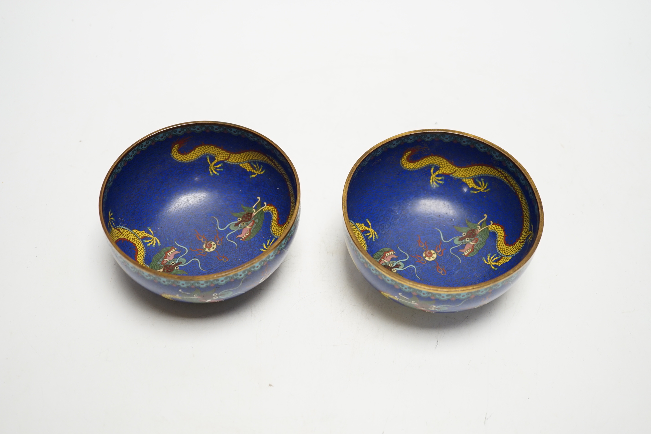 A pair of Chinese cloisonné enamel bowls decorated with dragons, c.1890-1910, signed lao tian li zhi, 11cm in diameter